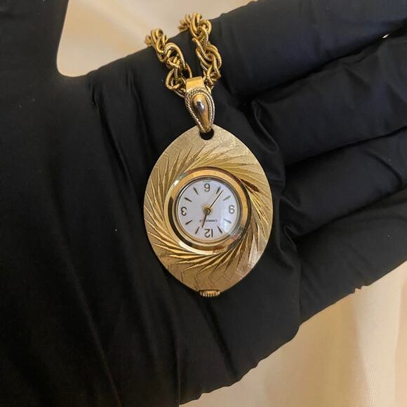 Vintage Caravelle Pendant Watch: Brocaded Gold Tone Oval 7 Jewel Mechanical main image 4